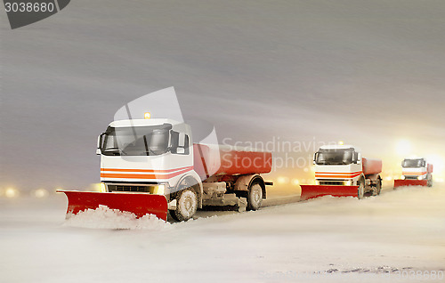 Image of Snowplow Trucks Removing the Snow