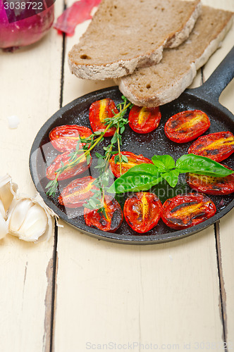 Image of baked cherry tomatoes with basil and thyme