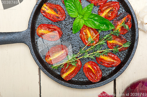 Image of baked cherry tomatoes with basil and thyme