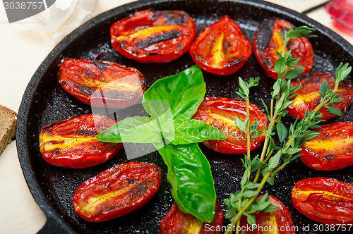 Image of baked cherry tomatoes with basil and thyme
