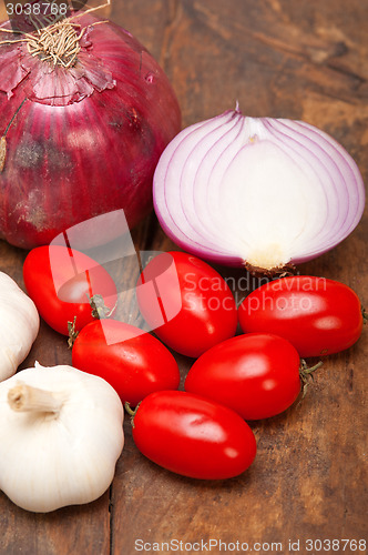 Image of onion garlic and tomatoes