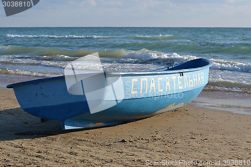 Image of The blue lifeboat on the bank of the Black Sea.