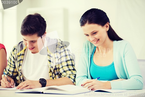 Image of students with textbooks and books at school