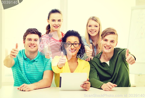 Image of smiling students with tablet pc computer at school