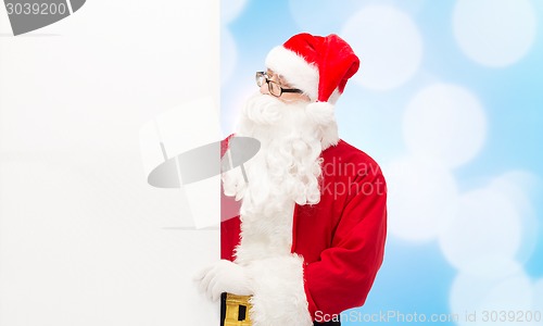 Image of man in costume of santa claus with billboard