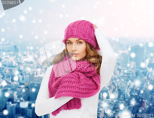 Image of smiling young woman in winter clothes