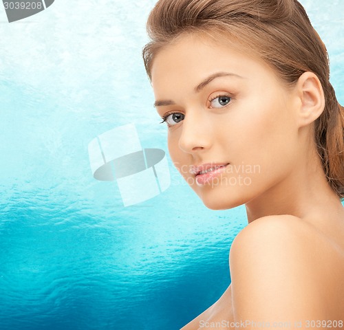 Image of beautiful young woman with bare shoulders