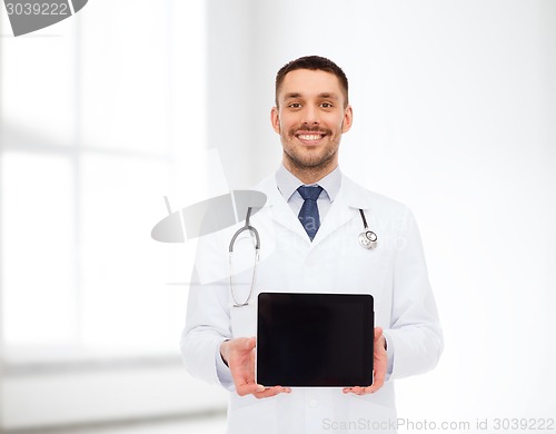 Image of smiling male doctor with tablet pc