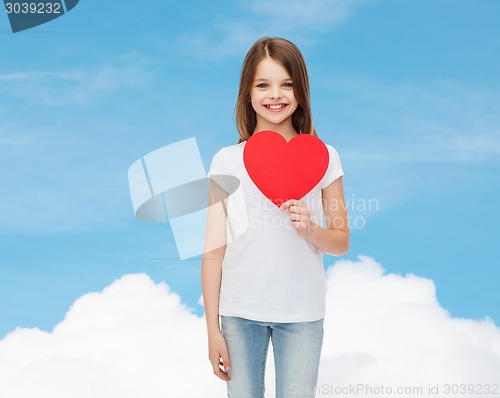 Image of beautiful little girl sitting at table