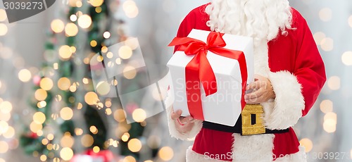 Image of man in costume of santa claus with gift box