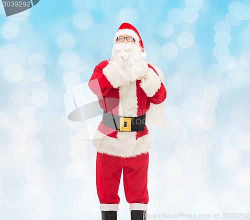 Image of man in costume of santa claus with bag