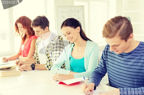 Image of students with textbooks and books at school