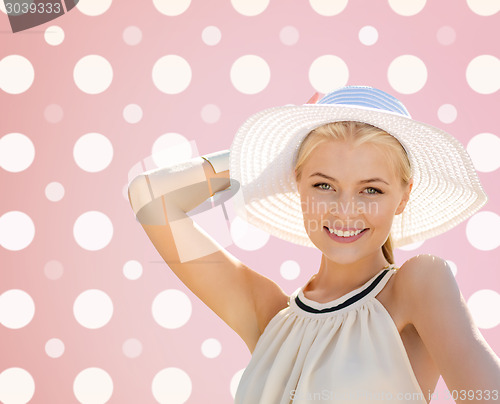 Image of beautiful smiling woman in white summer hat