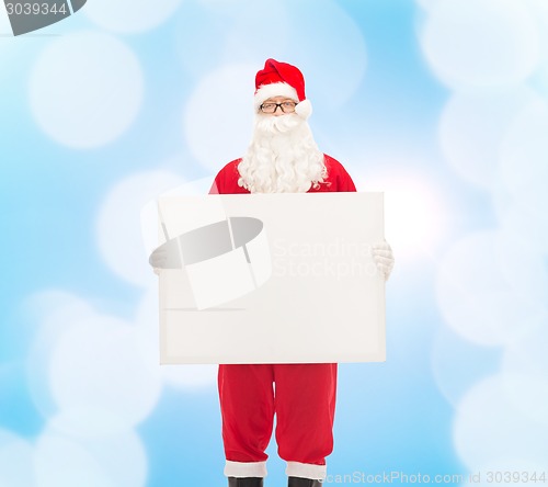 Image of man in costume of santa claus with billboard