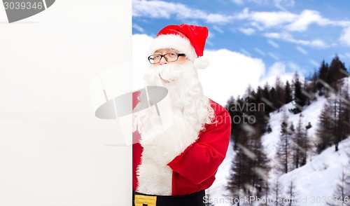 Image of man in costume of santa claus with billboard