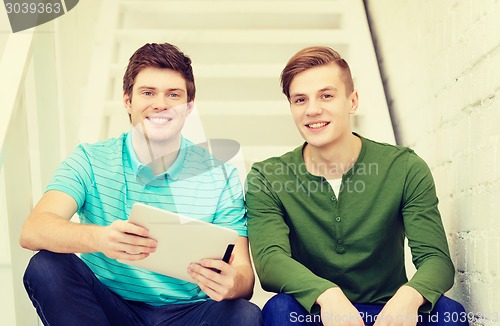 Image of smiling male students with tablet pc computer