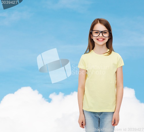 Image of smiling cute little girl in black eyeglasses