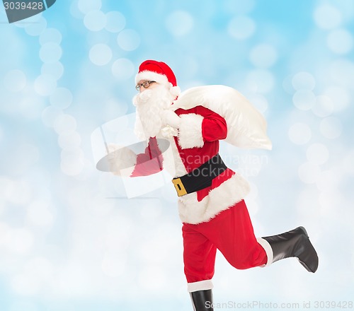 Image of man in costume of santa claus with bag