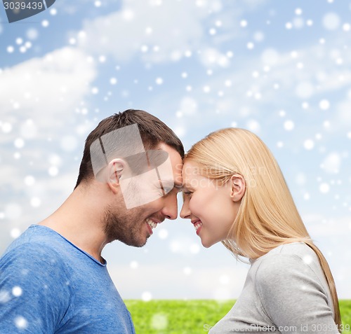 Image of smiling couple looking at each other