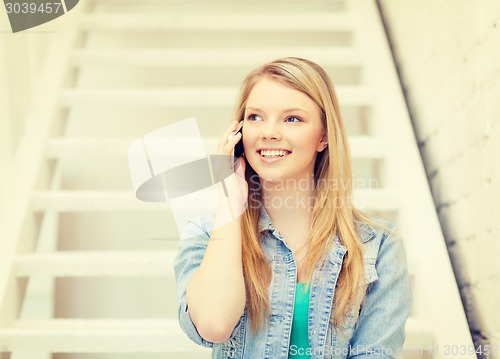 Image of smiling female student with smartphone