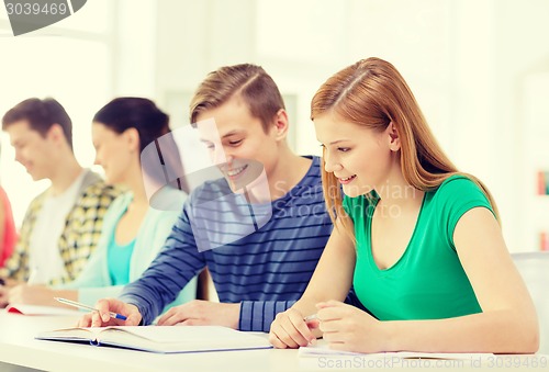 Image of students with textbooks and books at school