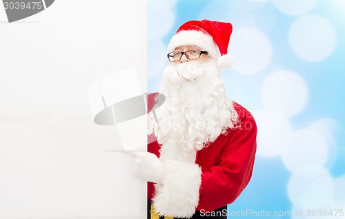 Image of man in costume of santa claus with billboard