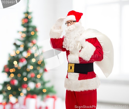 Image of man in costume of santa claus with bag