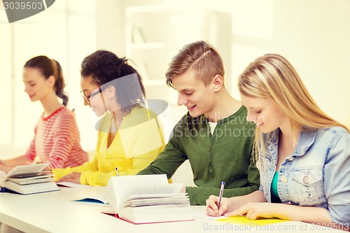 Image of students with textbooks and books at school