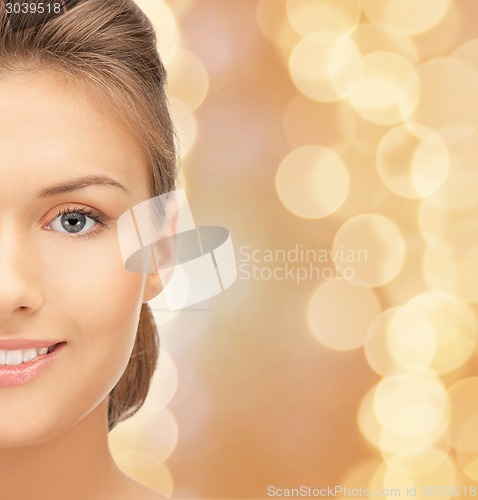 Image of beautiful young woman half face