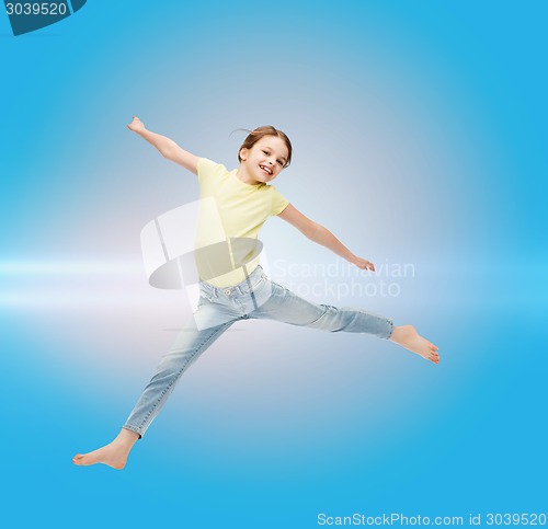 Image of smiling little girl jumping