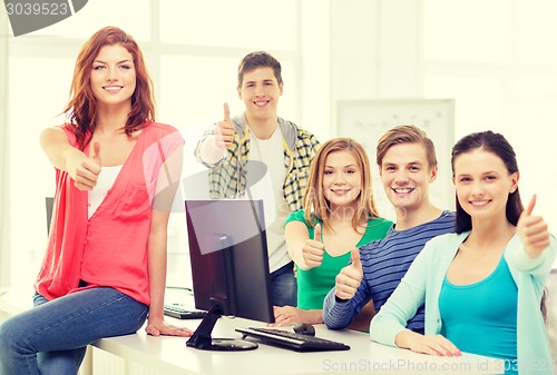 Image of group of smiling students showing thumbs up