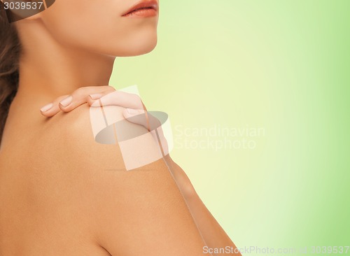Image of beautiful young woman with bare shoulders