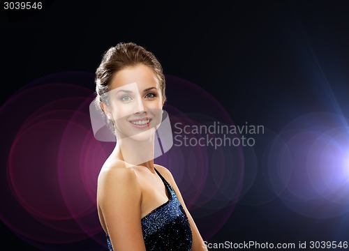 Image of smiling woman in evening dress