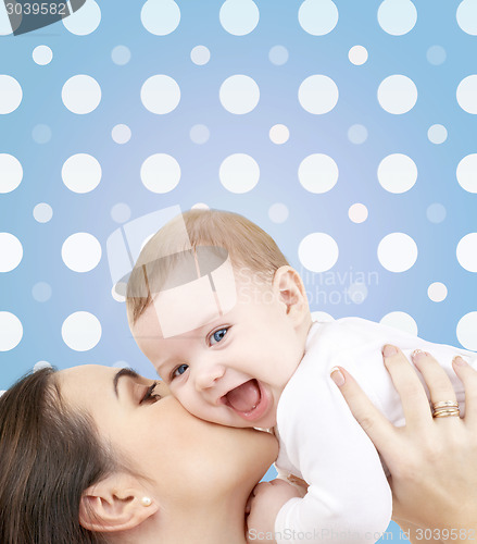 Image of laughing baby playing with mother