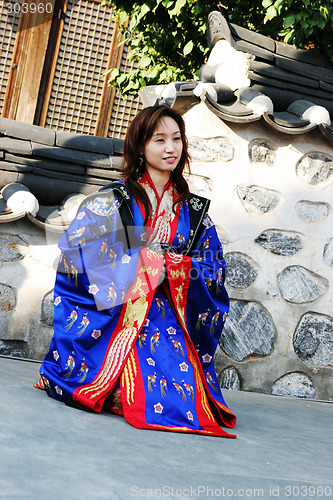 Image of Asian woman in traditional South Korean robes.