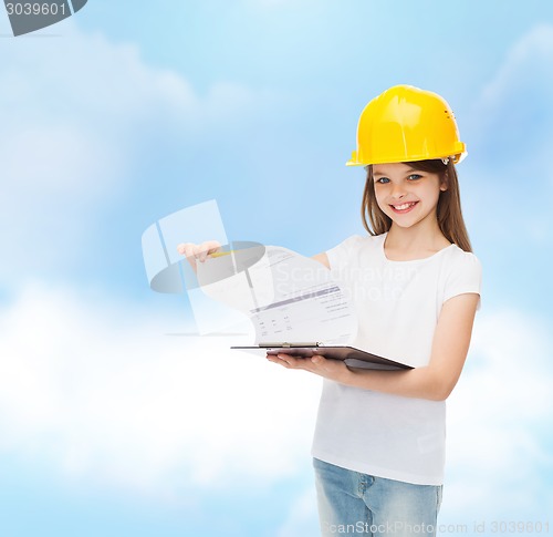 Image of smiling little girl in hardhat with clipboard