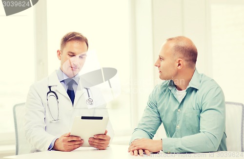 Image of doctor with tablet pc and patient in hospital