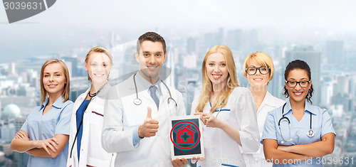 Image of group of young doctors with tablet pc computer