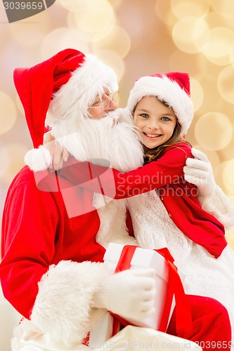 Image of smiling little girl with santa claus