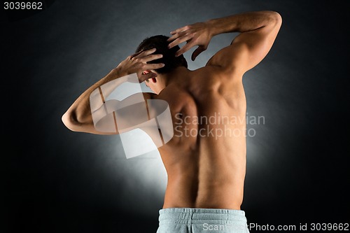 Image of young male bodybuilder from back