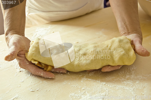 Image of Hands shows cake