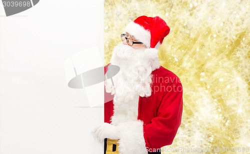 Image of man in costume of santa claus with billboard