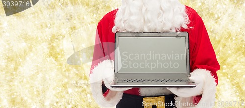 Image of close up of santa claus with laptop