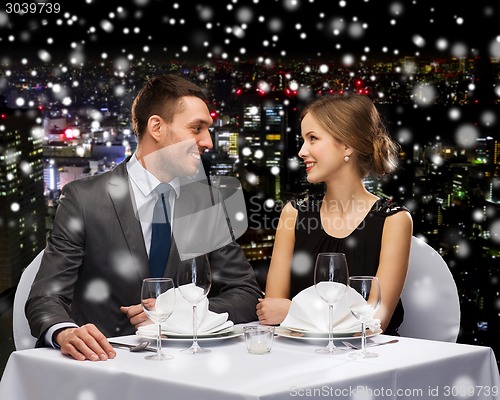 Image of smiling couple at restaurant