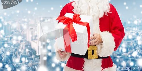 Image of man in costume of santa claus with gift box