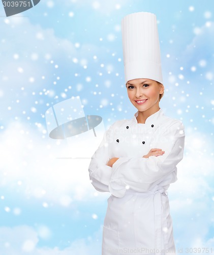 Image of smiling female chef dreaming