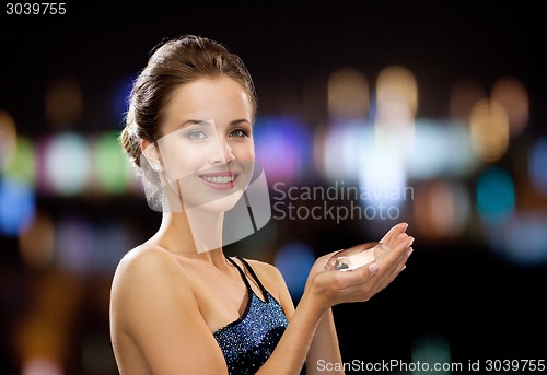 Image of smiling woman in evening dress with diamond