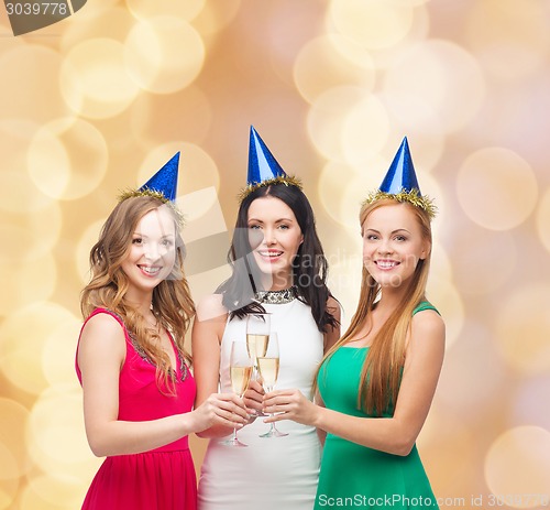 Image of smiling women holding glasses of sparkling wine