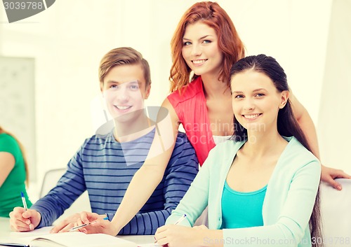 Image of students with textbooks and books at school