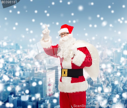 Image of man in costume of santa claus with bag